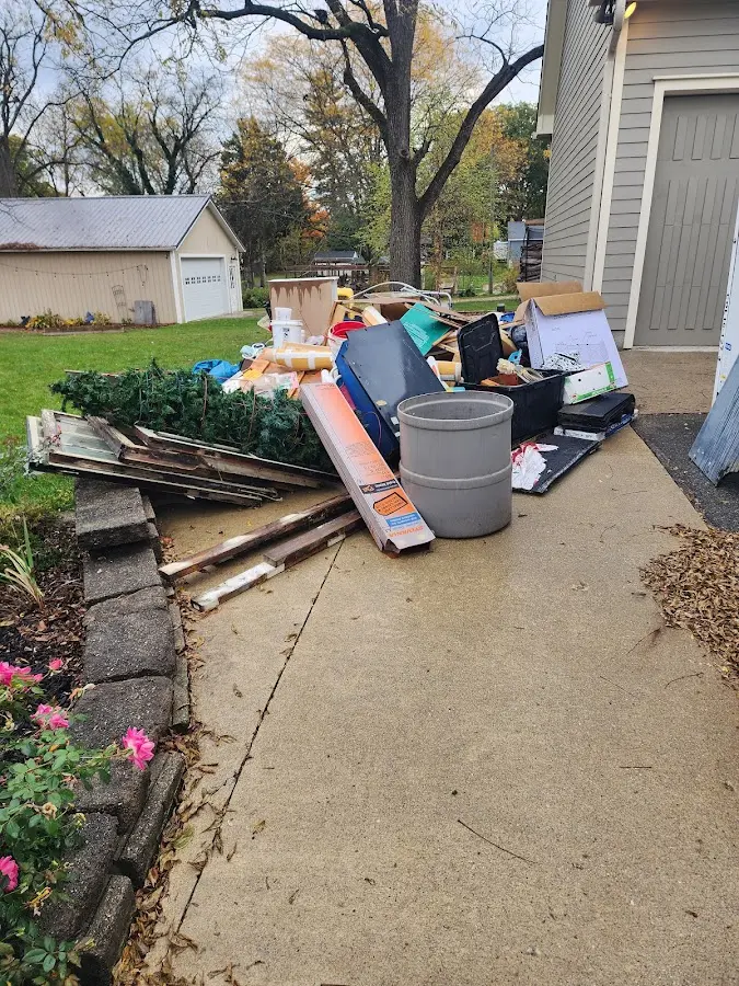 Dumpster being loaded with debris for Estate Cleanout Dumpster Rental in Humboldt